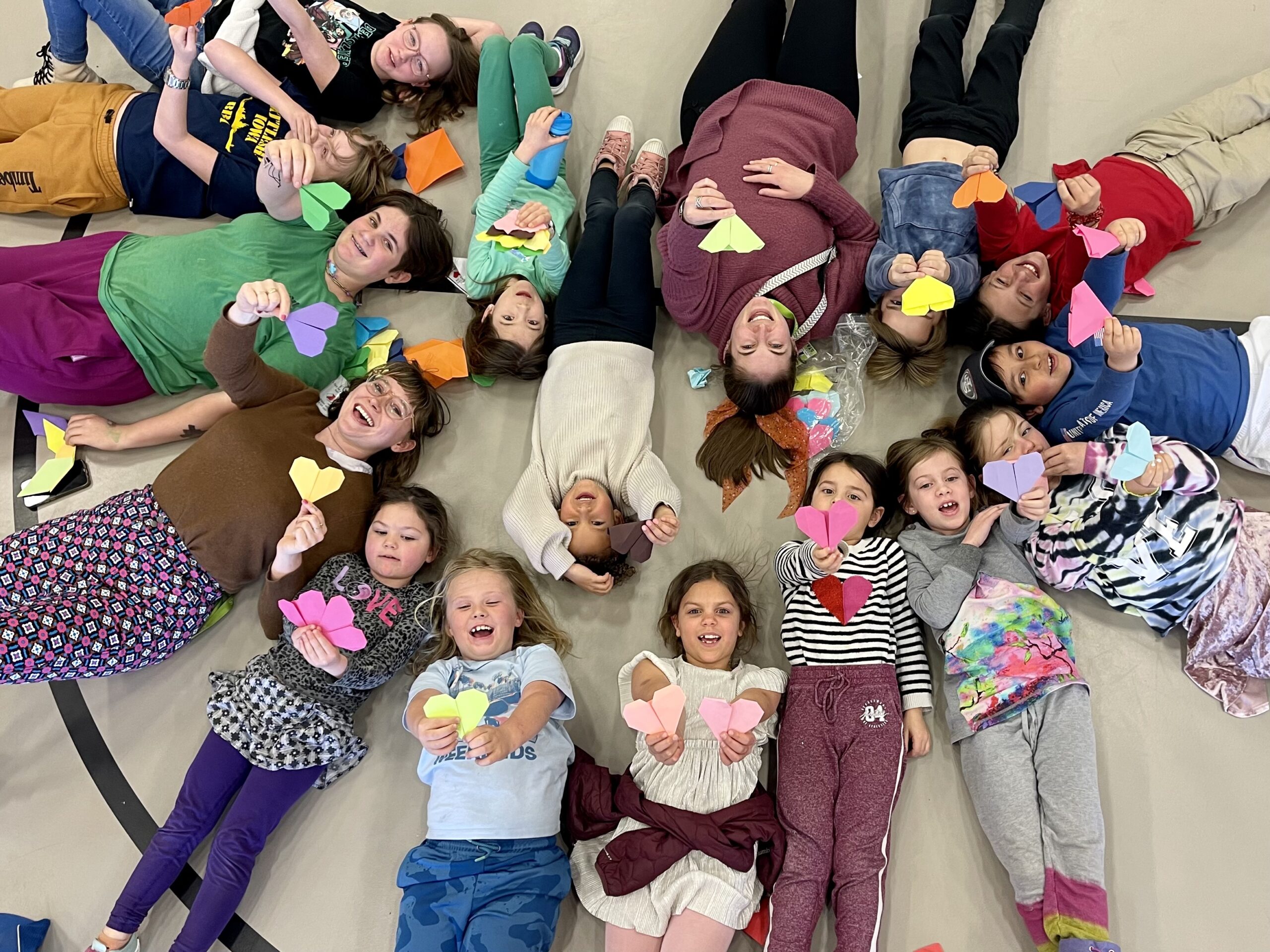 MSD Community Gatherings | Montessori School of Denver Traditions: Beehives | MSD Teachers, Staff, and Students participate in making origami hearts for Beehives